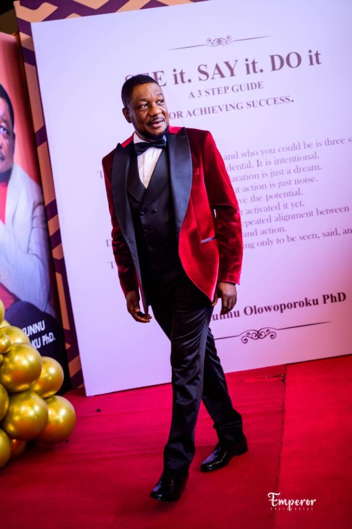 Dr. Ayokunnu Olowoporoku walking the red carpet at the launch of SEE It, SAY It, DO It
