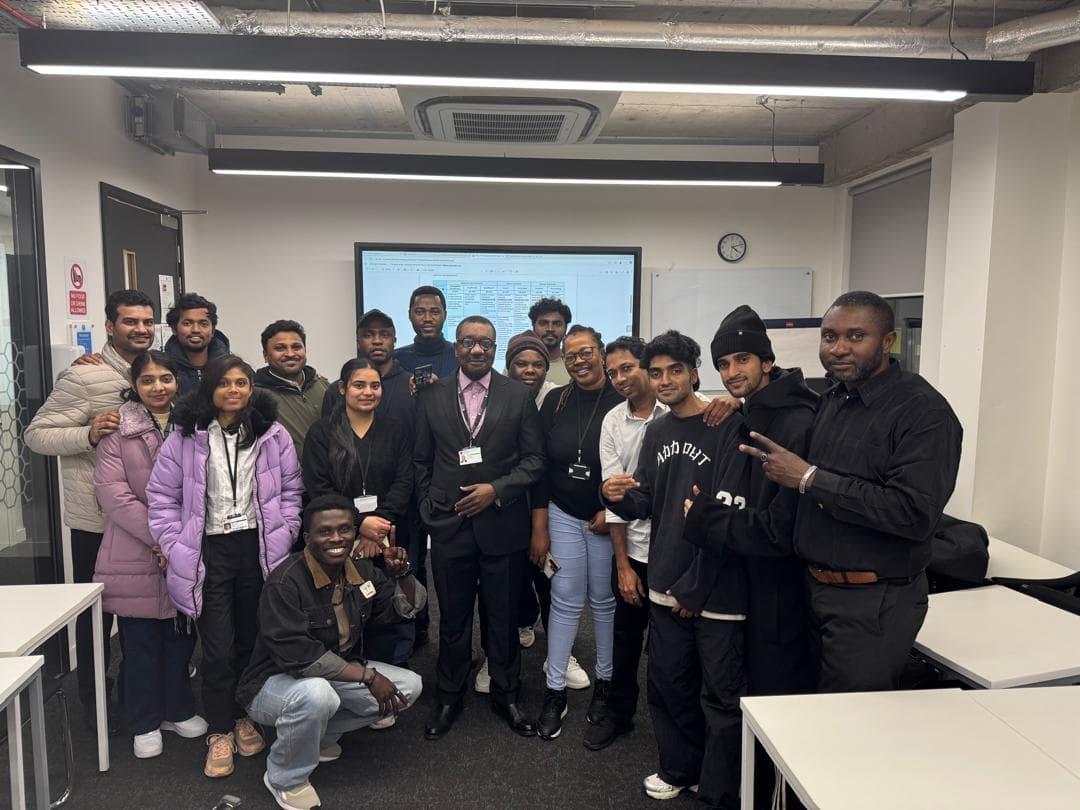Dr. Ayokunnu Olowoporoku at a whiteboard with a seminar cohort at Northumbria University